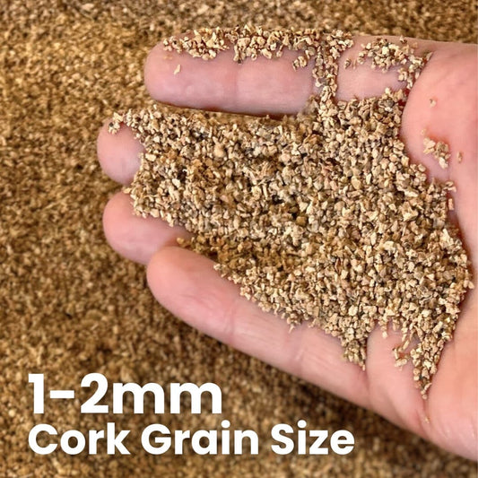 Cork grain size of 1-2mm held in a hand shows the granule size, texture and color.