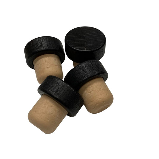 Black wood cap stopper with synthetic cork stem – side view of four stoppers