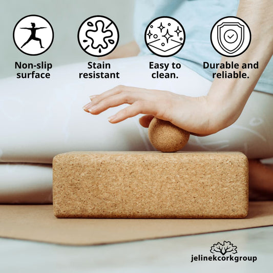 Cork yoga block with hand applying pressure, surrounded by icons and text about product features, on a light background.