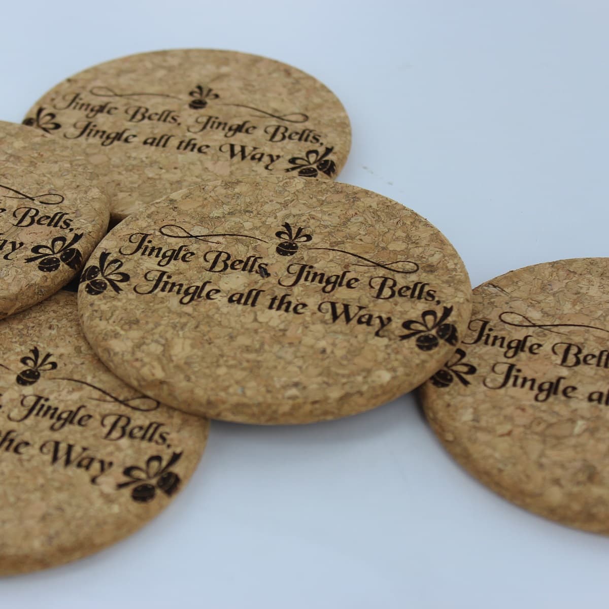 Round cork coasters with custom printed words and graphics.