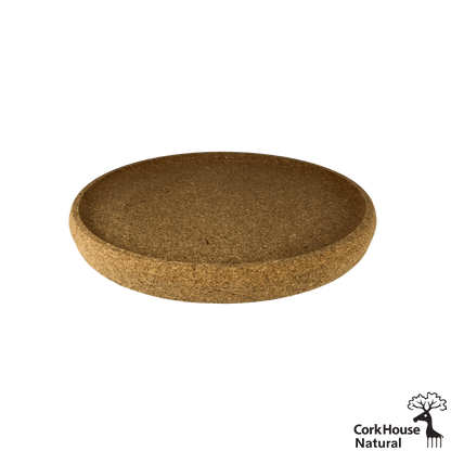 Side View shot the natural cork circular tray featuring a raised lip. 