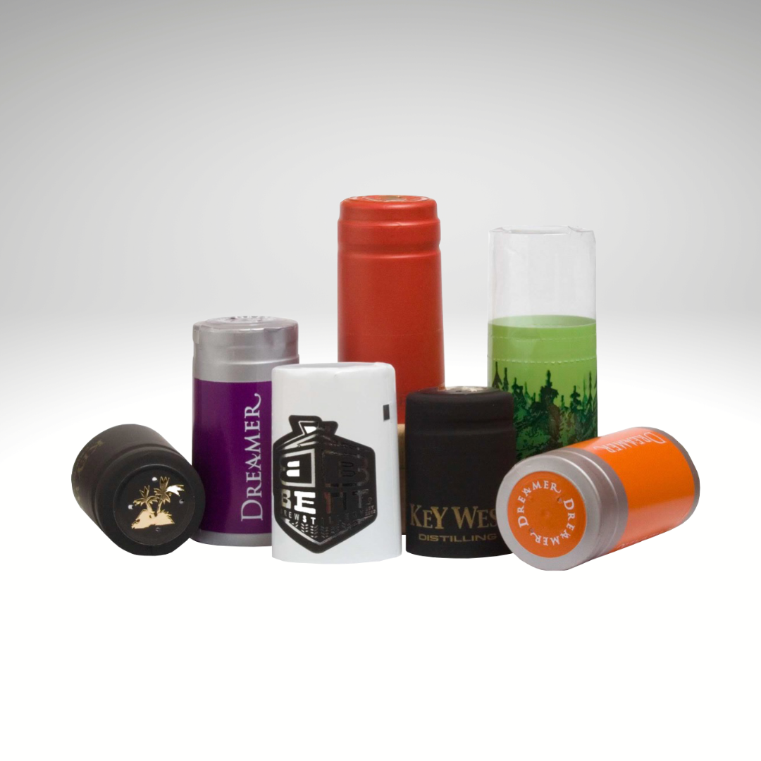 7 different custom shrink caps showing a range of the possibilities available. 