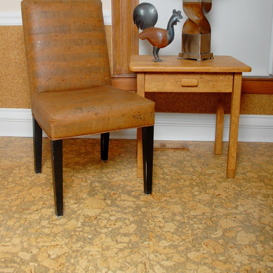 Corkstone cork flooring in a sitting area with a dark cork fabric chair and solid cork table