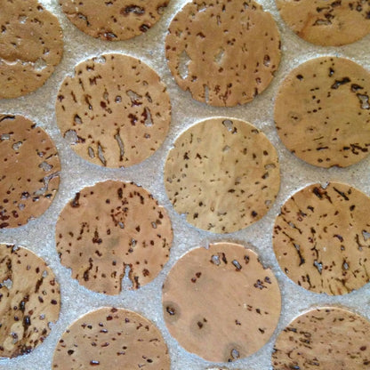 Close-up of mosaic Cork flooring showing the round Cork discs with white grout