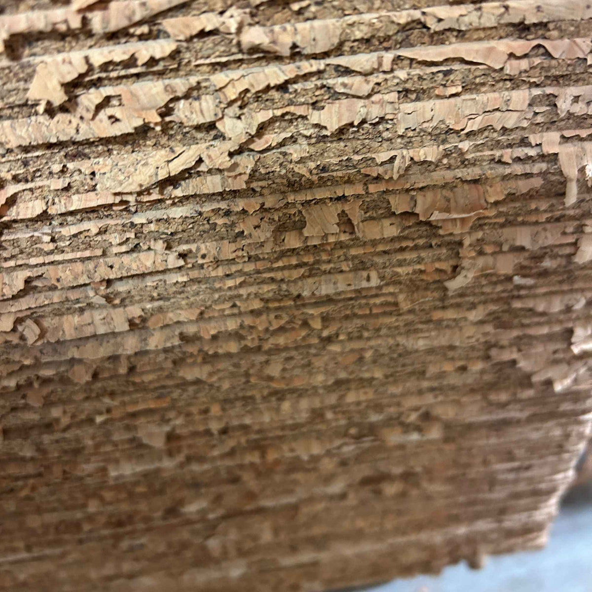 Close-up showing the edges of the untrimmed cork floor tile