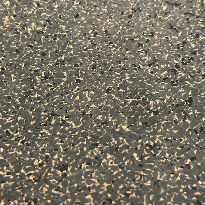 A close-up to show the pattern and colors of the Boulder rubber cork floor tile - speckles of dark grey, tan and black.