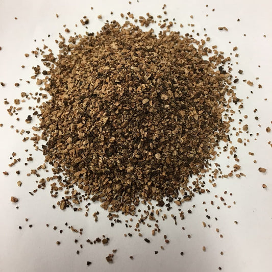 A pile of granulated cork size of 1-2mm shows the grain size, texture and color.