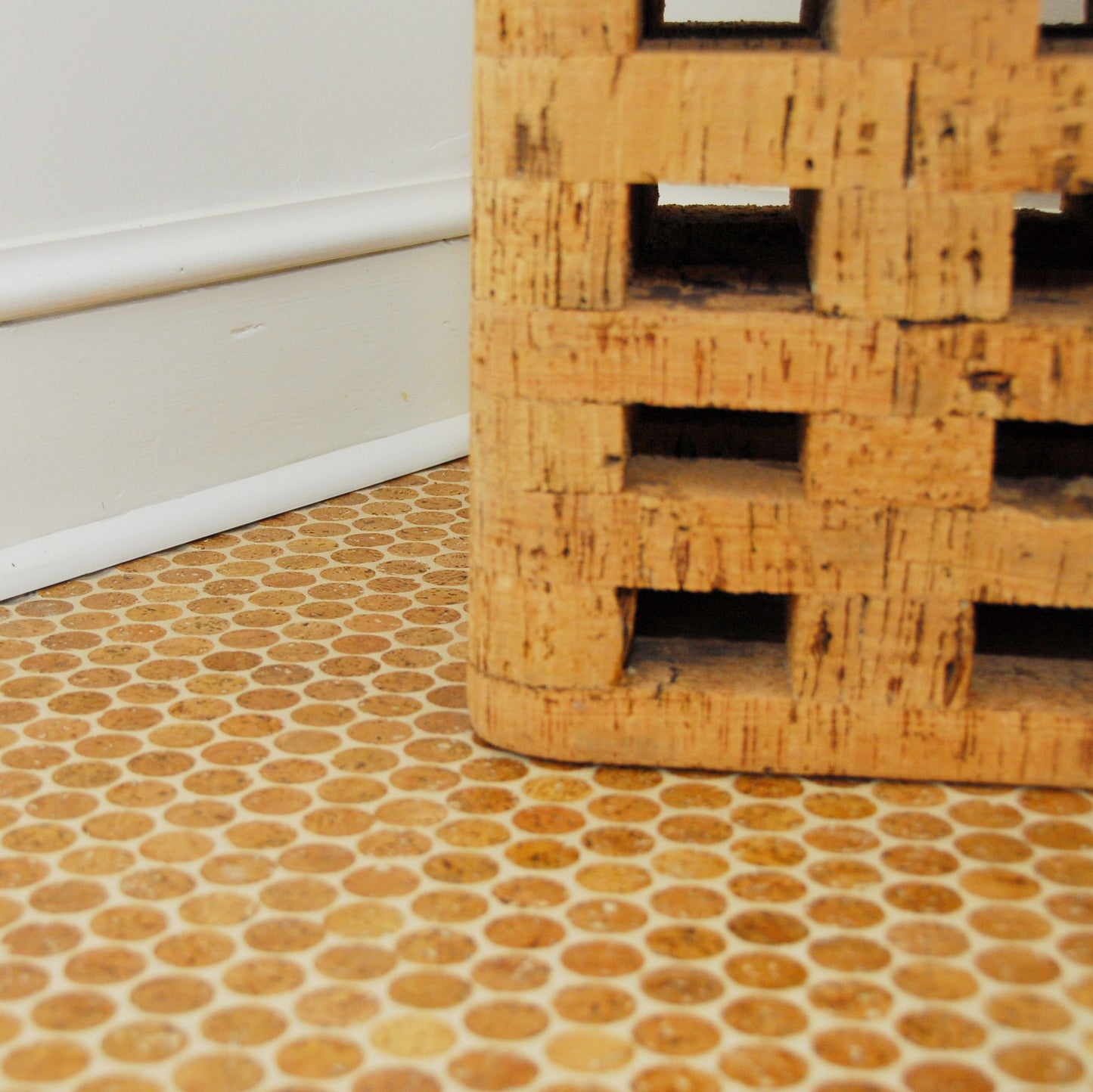 Mosaic Coach Cork flooring install installed with a cork brick sitting on top of it