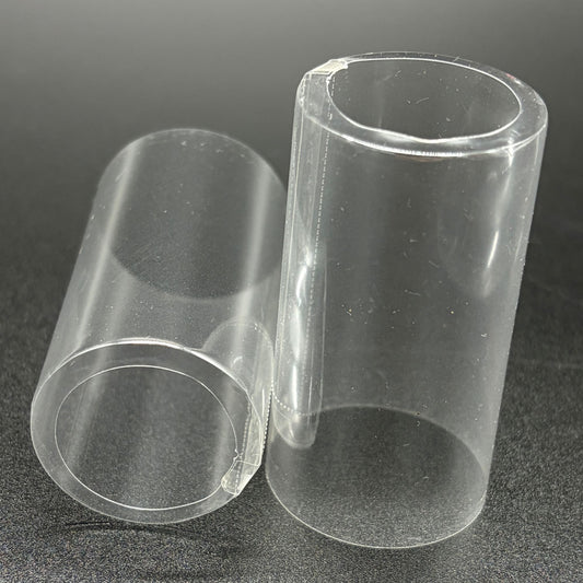 Two clear open cap PVC shrink caps with vertical perforations