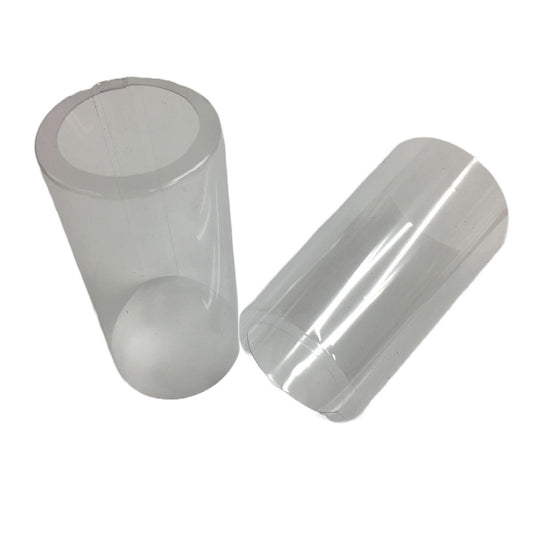 Two clear PVC shrink caps with an open cap on a white background