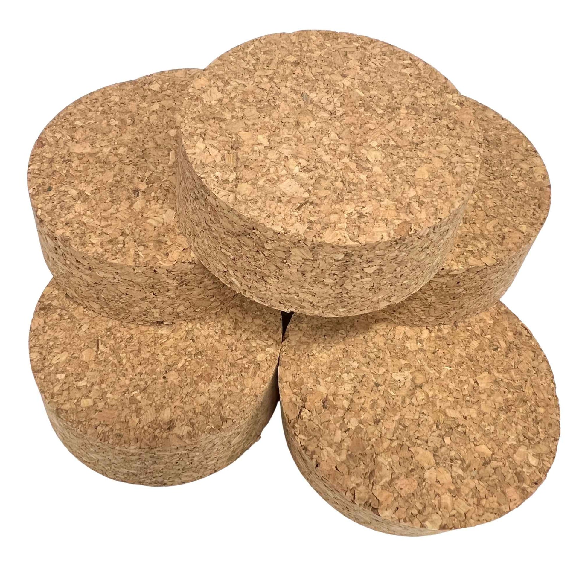 A stack of agglomerate short length tapered cork stoppers, size SL42