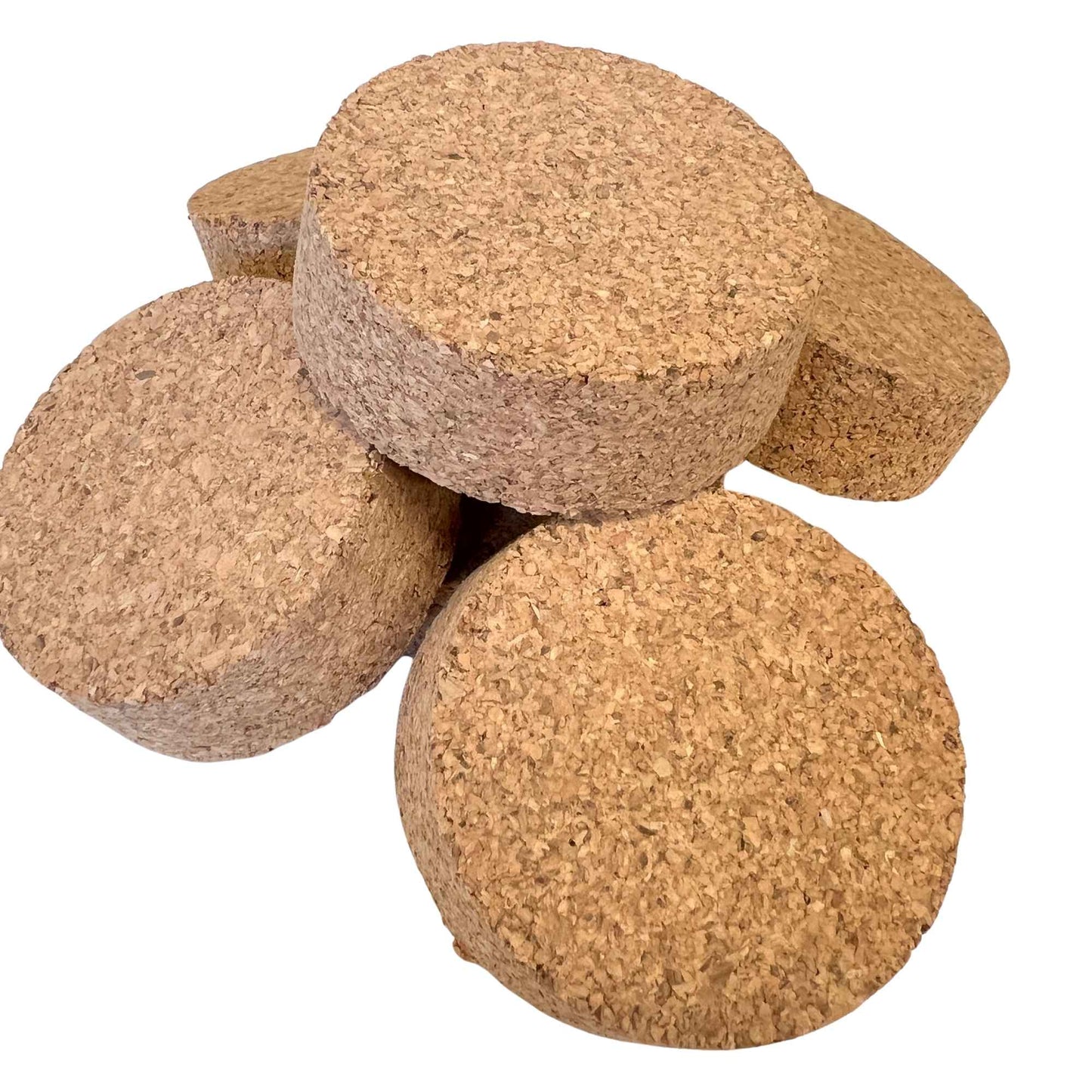 Closeup of bulk agglomerate short length tapered cork stoppers, size SL46