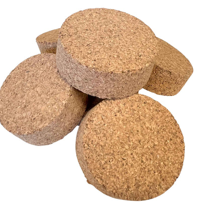Closeup of bulk agglomerate short length tapered cork stoppers, size SL46