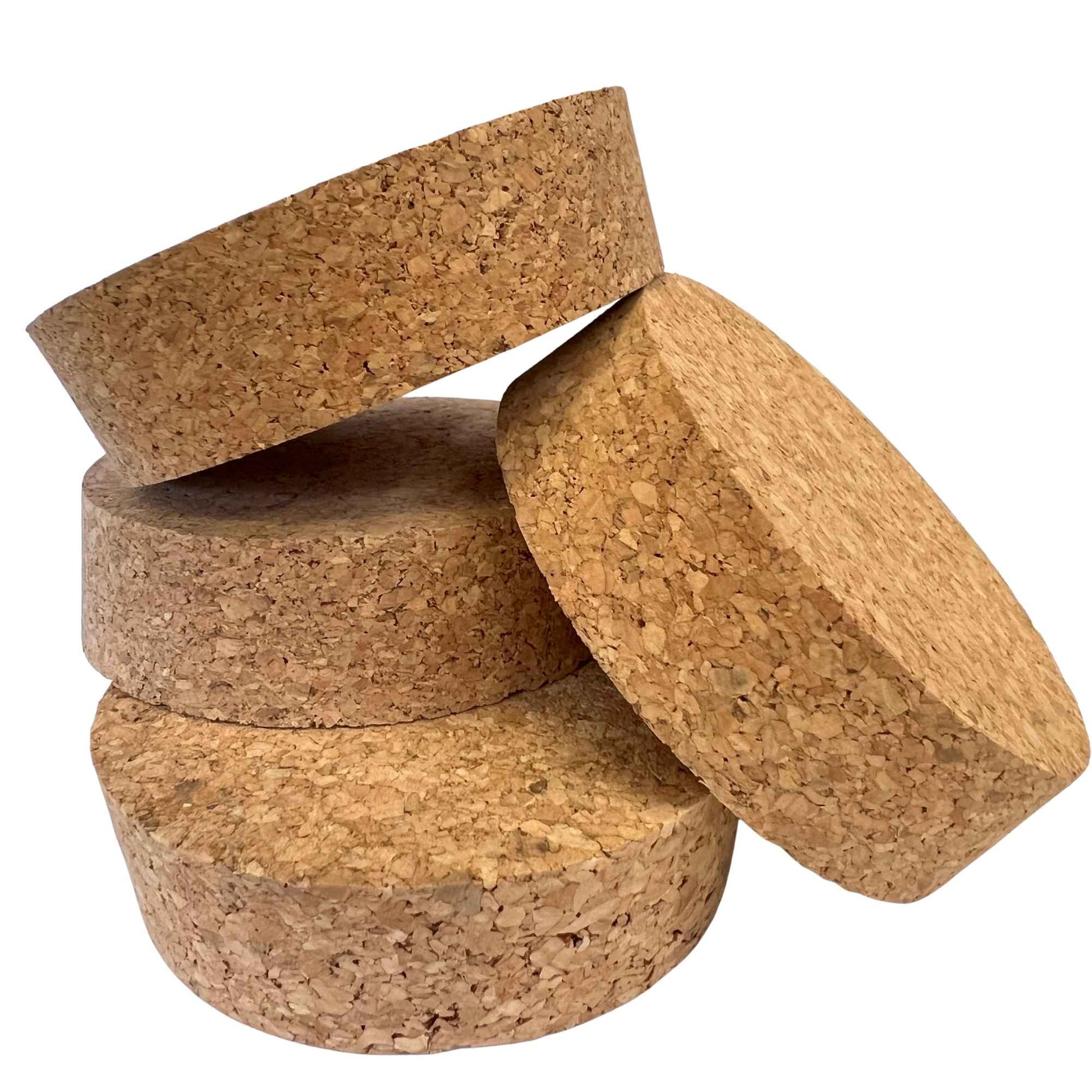 A stack of agglomerate short length tapered cork stoppers, size SL52