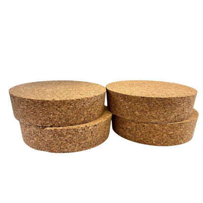 A stack of agglomerate short length tapered cork stoppers, size SL58