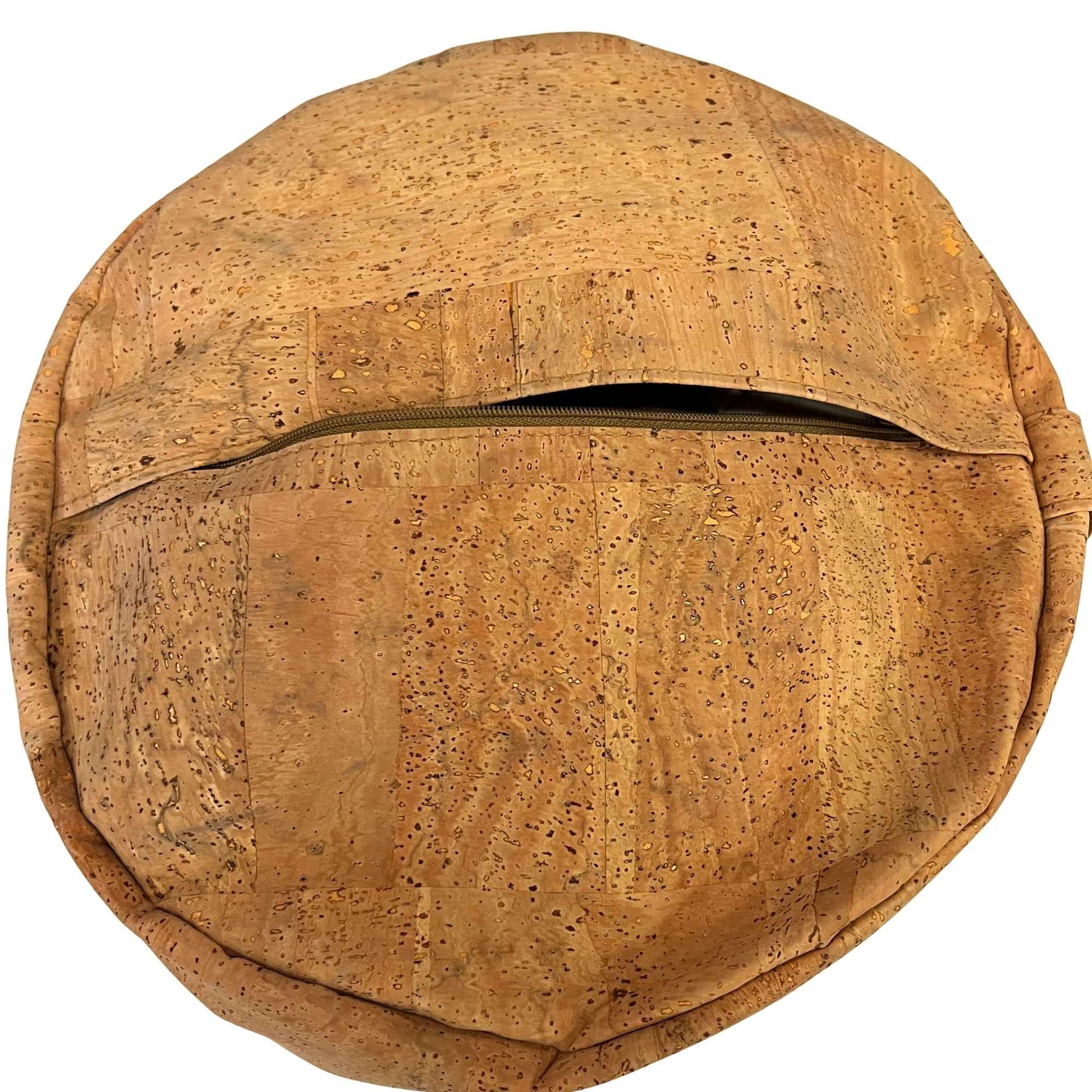 Round cork yoga pillow open to show zipper made with Harmony cork upholstery fabric.